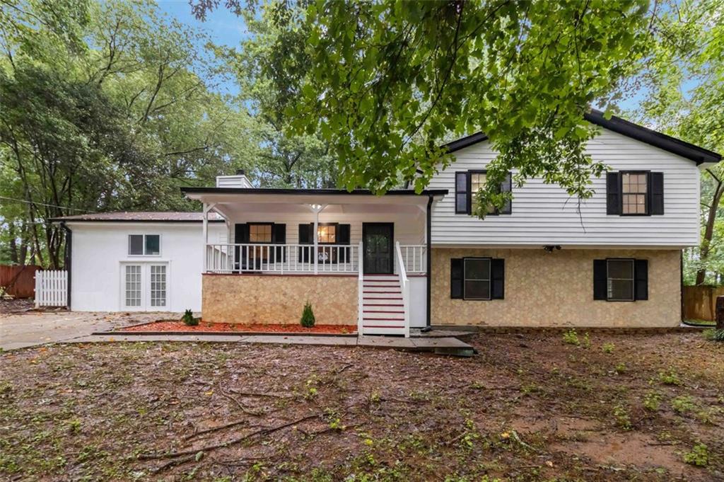 488 Russell Road Lawrenceville, GA 30043 - Photo 1 of 1 front view of a house with a yard