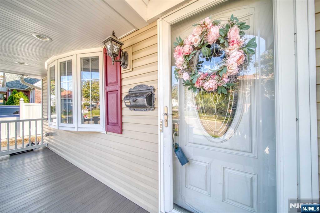 202 Stone Street Maywood, NJ 07607 - Photo 6 of 11 a view of a hallway with wooden floor and a potted plant