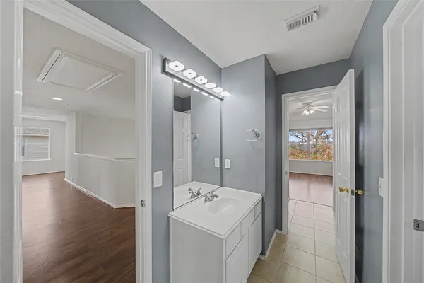 a bathroom with a sink and mirror