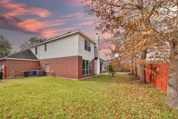 a backyard of a house with yard and garage
