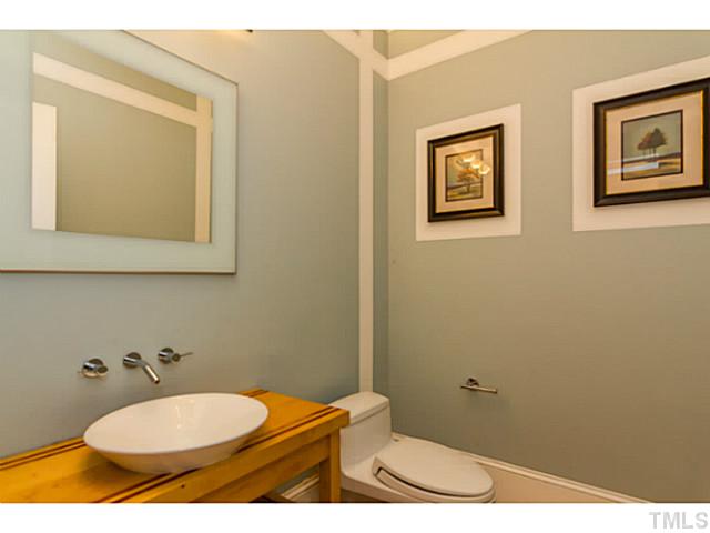 1300 Milvaney Court Raleigh, NC 27615 - Photo 9 of 25 First floor half bath with wall mount faucet.