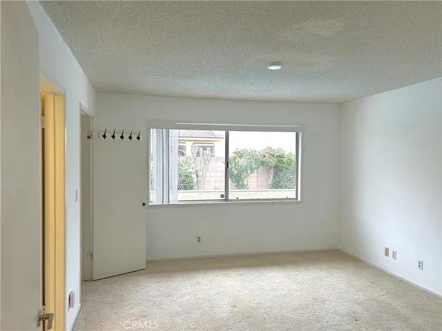 a bathroom with a granite countertop sink a toilet a large mirror a bathtub and shower