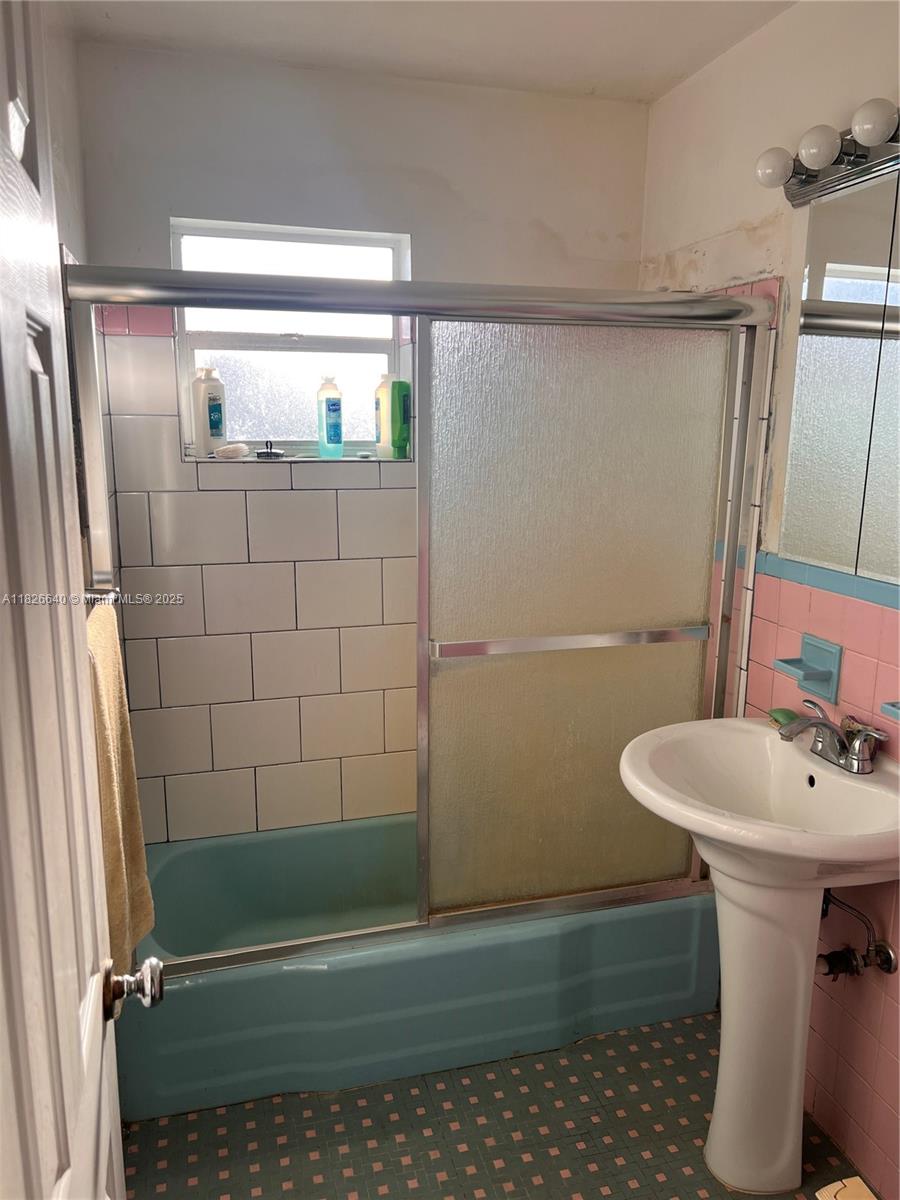 4475 Kirk Road Lake Worth, FL 33461 - Photo 14 of 26 a bathroom with a sink toilet and shower