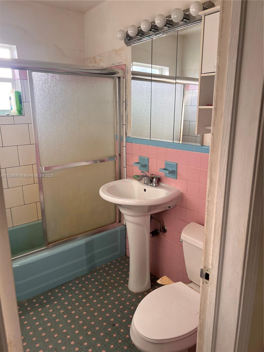 4475 Kirk Road Lake Worth, FL 33461 - Photo 15 of 26 a bathroom with a sink toilet and shower