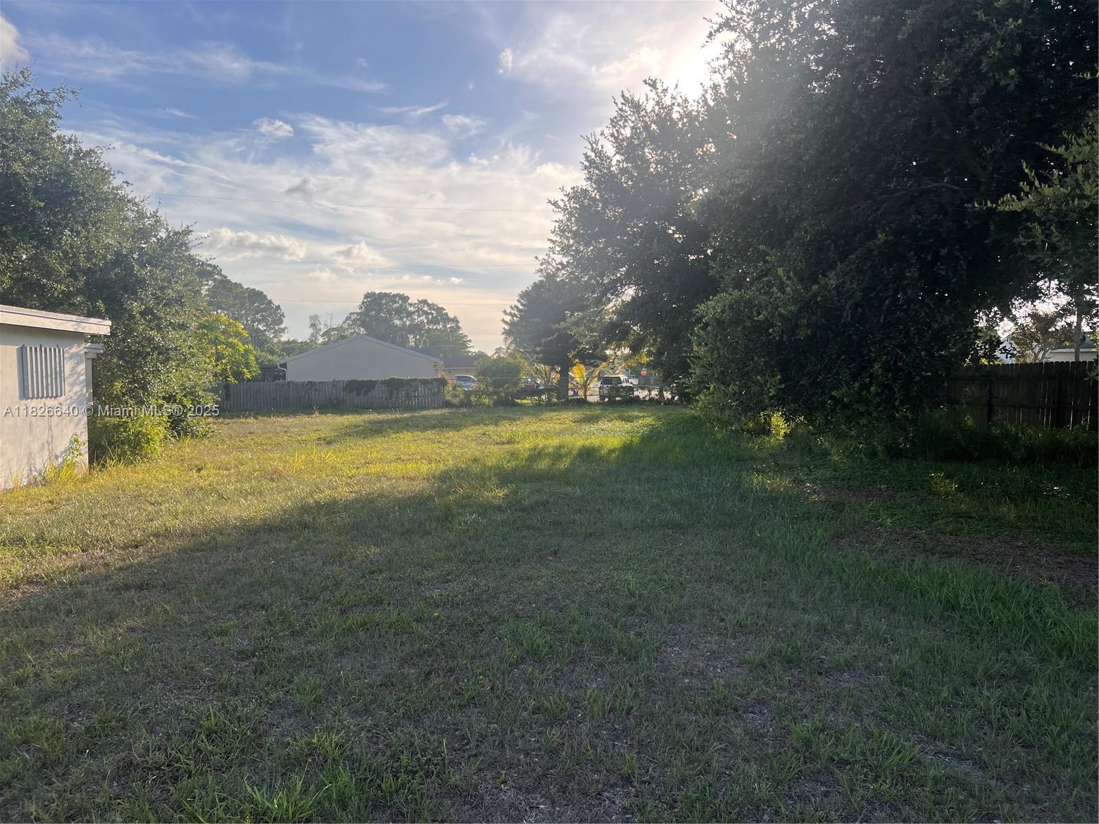 4475 Kirk Road Lake Worth, FL 33461 - Photo 3 of 26 a view of an ocean swimming pool and trees