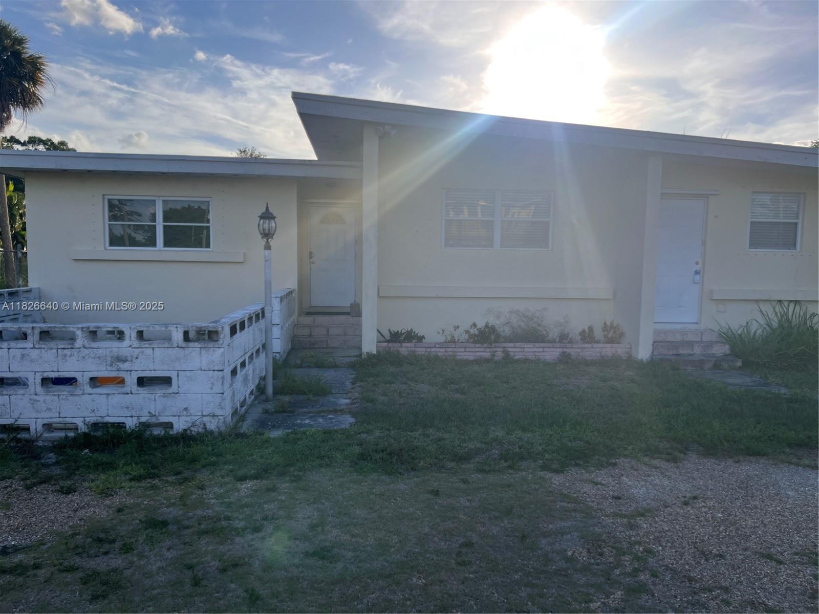 4475 Kirk Road Lake Worth, FL 33461 - Photo 5 of 26 a view of a house with a yard