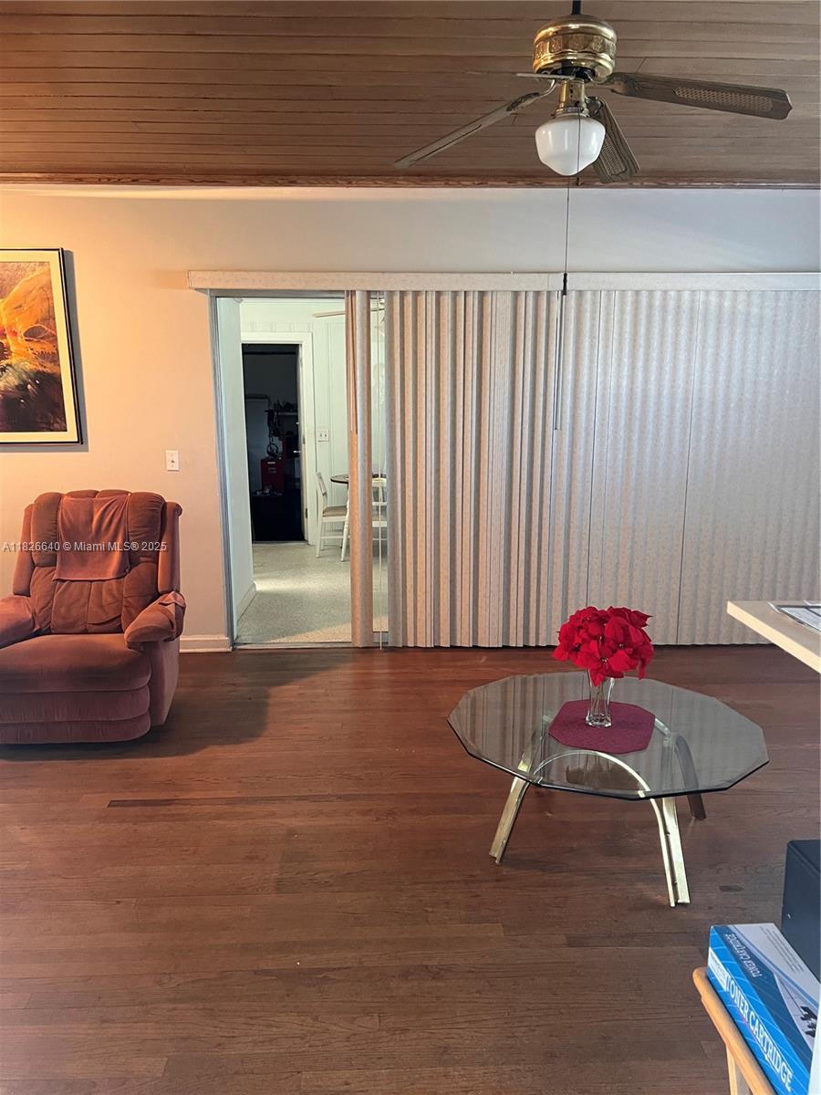 4475 Kirk Road Lake Worth, FL 33461 - Photo 9 of 26 a living room with furniture and a chandelier