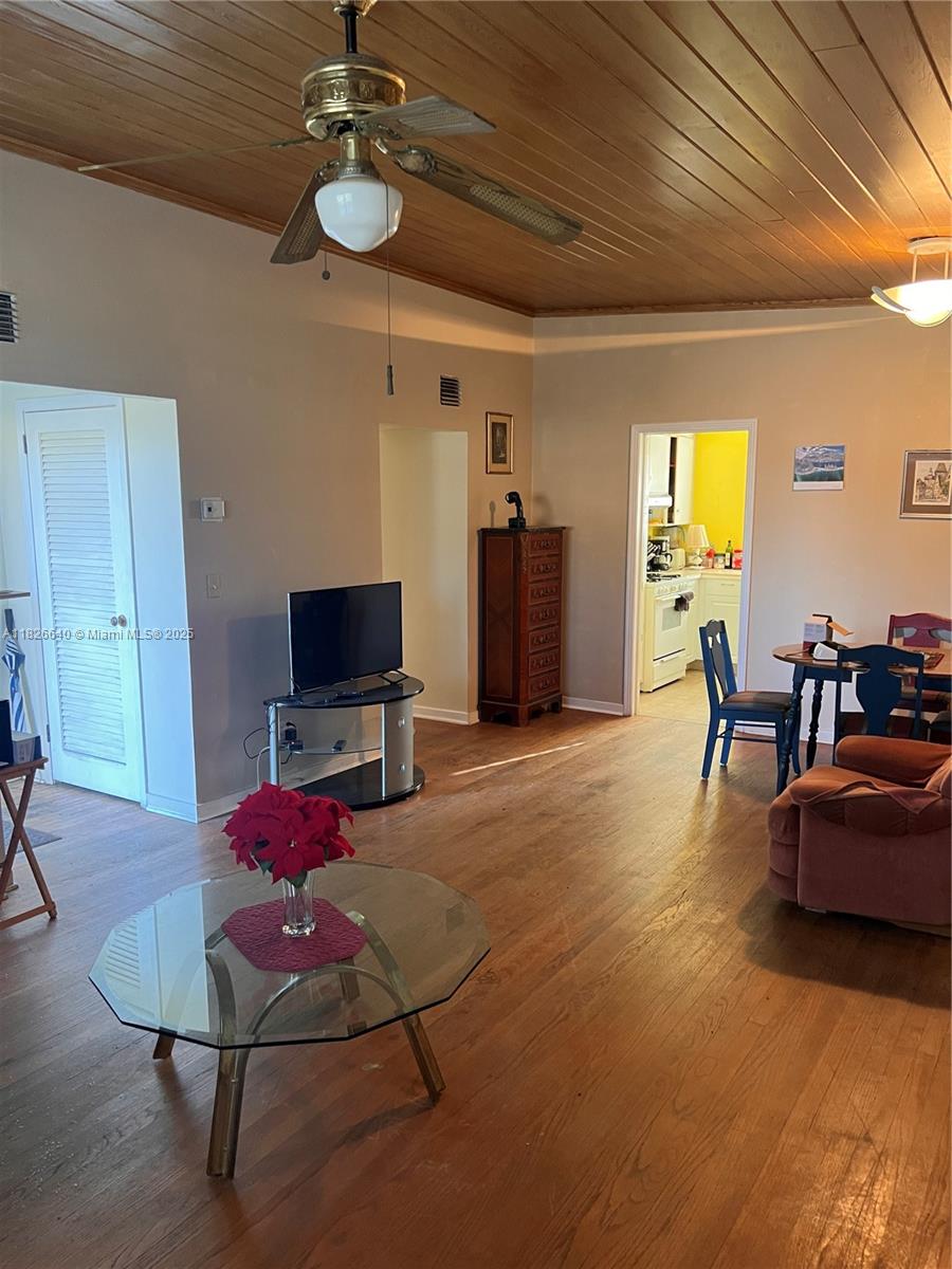 4475 Kirk Road Lake Worth, FL 33461 - Photo 10 of 26 a living room with furniture and a flat screen tv