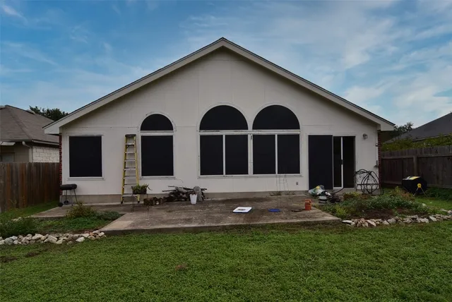 a front view of house with garage and yard