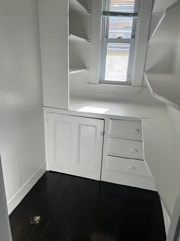 a view of cabinets and window