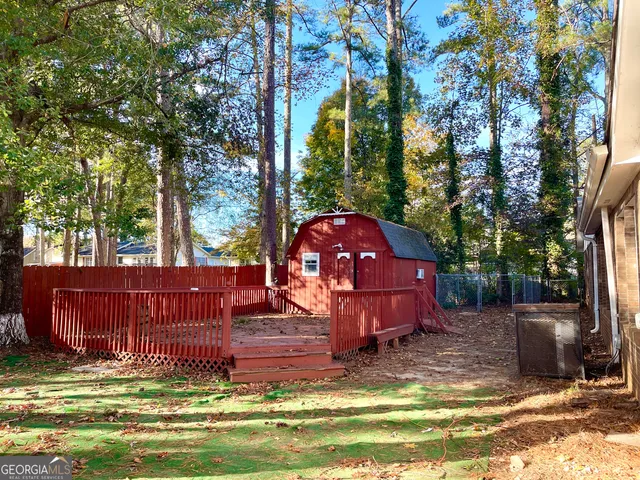 a view of a yard with large tree and a yard