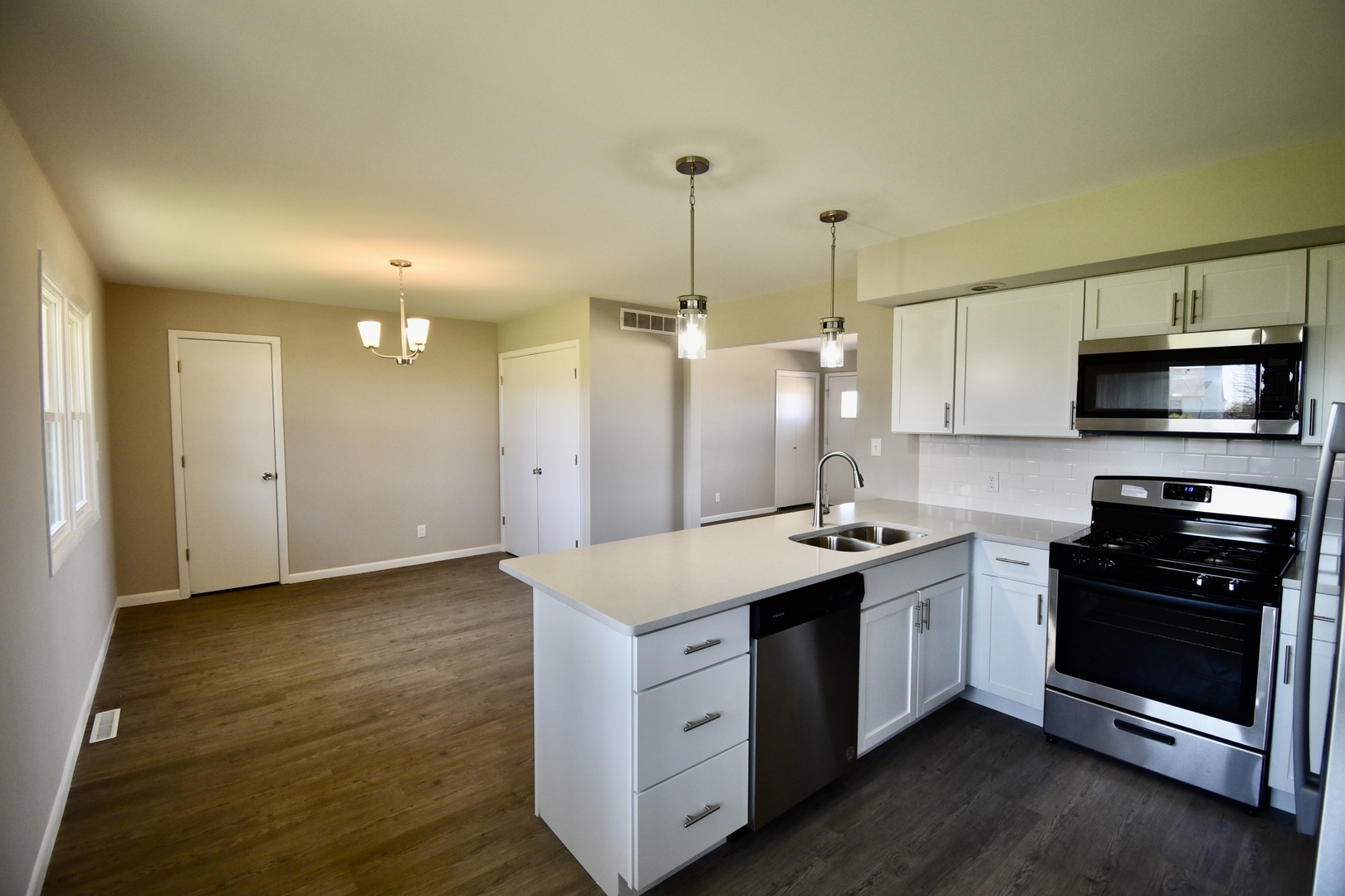 413 East Northtown Road North Normal, IL 61761 - Photo 12 of 20 a kitchen with a sink stove and microwave