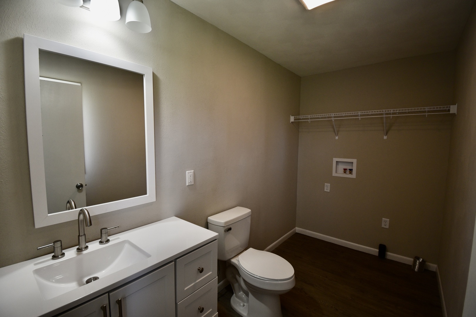 413 East Northtown Road North Normal, IL 61761 - Photo 13 of 20 a bathroom with a sink a toilet and vanity
