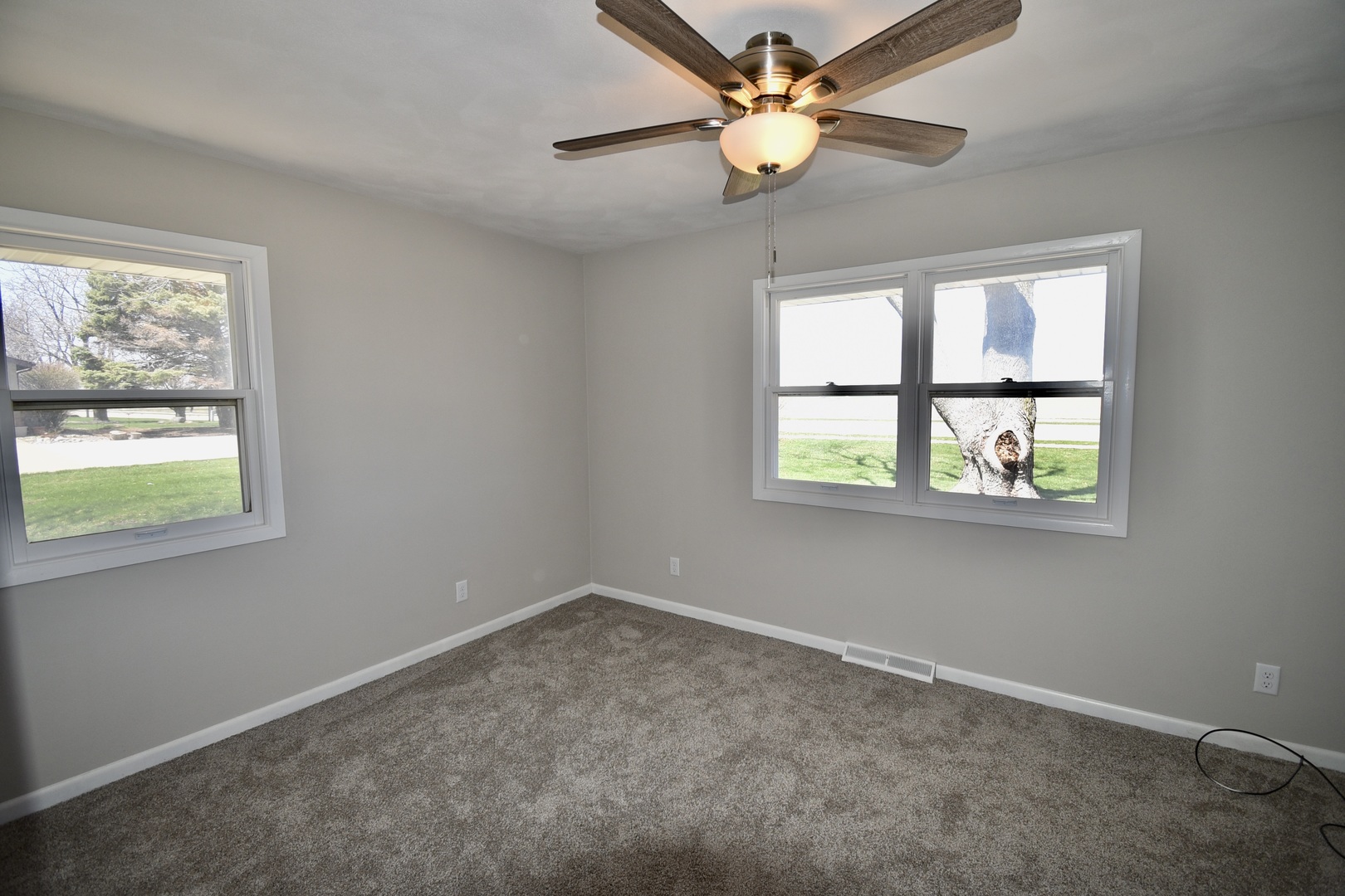 413 East Northtown Road North Normal, IL 61761 - Photo 15 of 20 an empty room with windows and fan