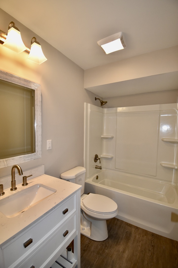 413 East Northtown Road North Normal, IL 61761 - Photo 20 of 20 a bathroom with a sink a toilet and shower