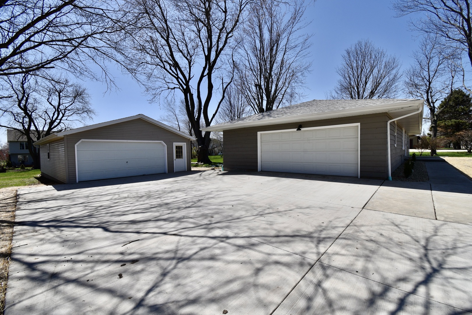 413 East Northtown Road North Normal, IL 61761 - Photo 2 of 20 a front view of a house with a yard and garage
