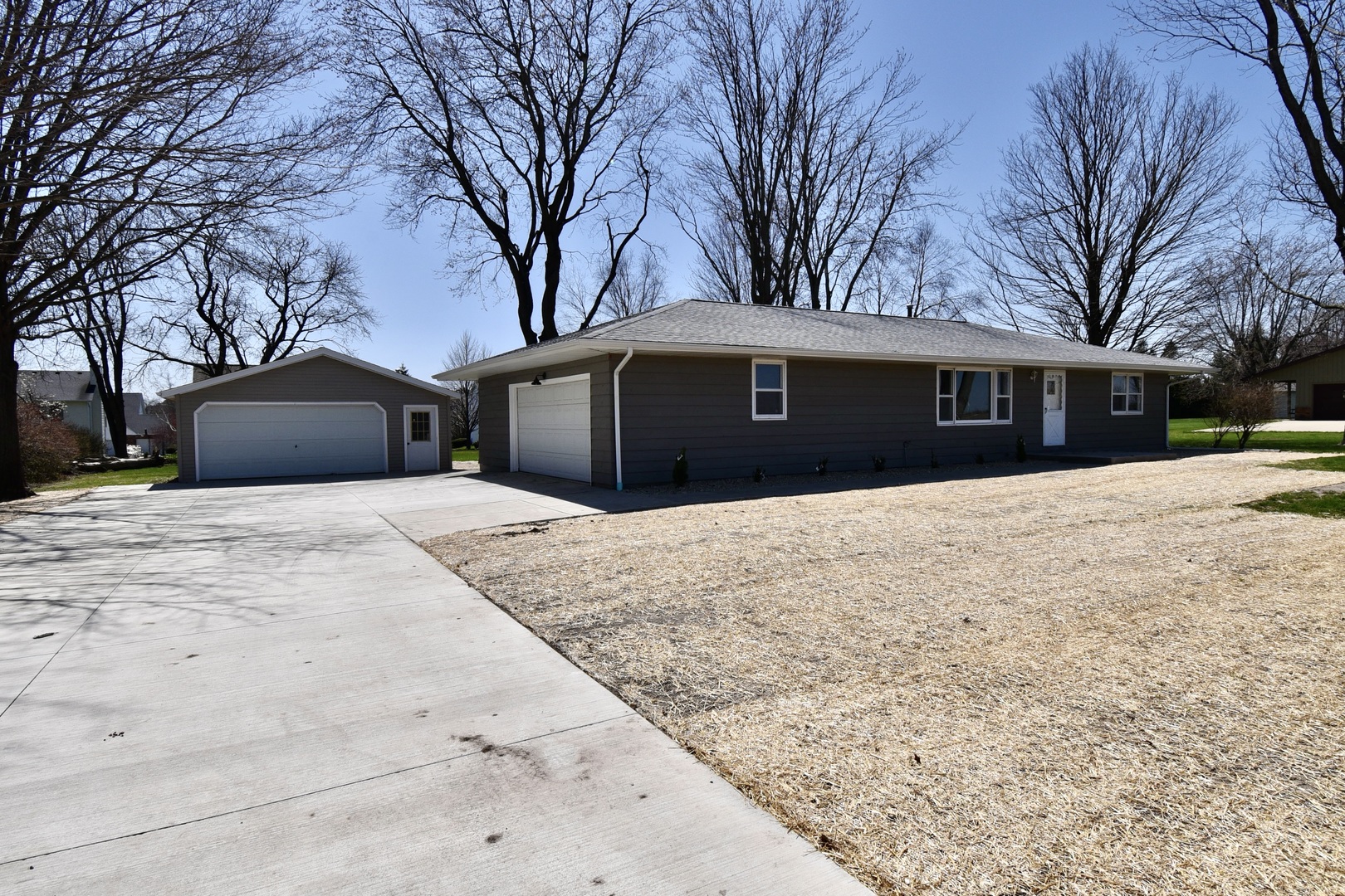413 East Northtown Road North Normal, IL 61761 - Photo 3 of 20 a front view of a house with a yard covered in snow