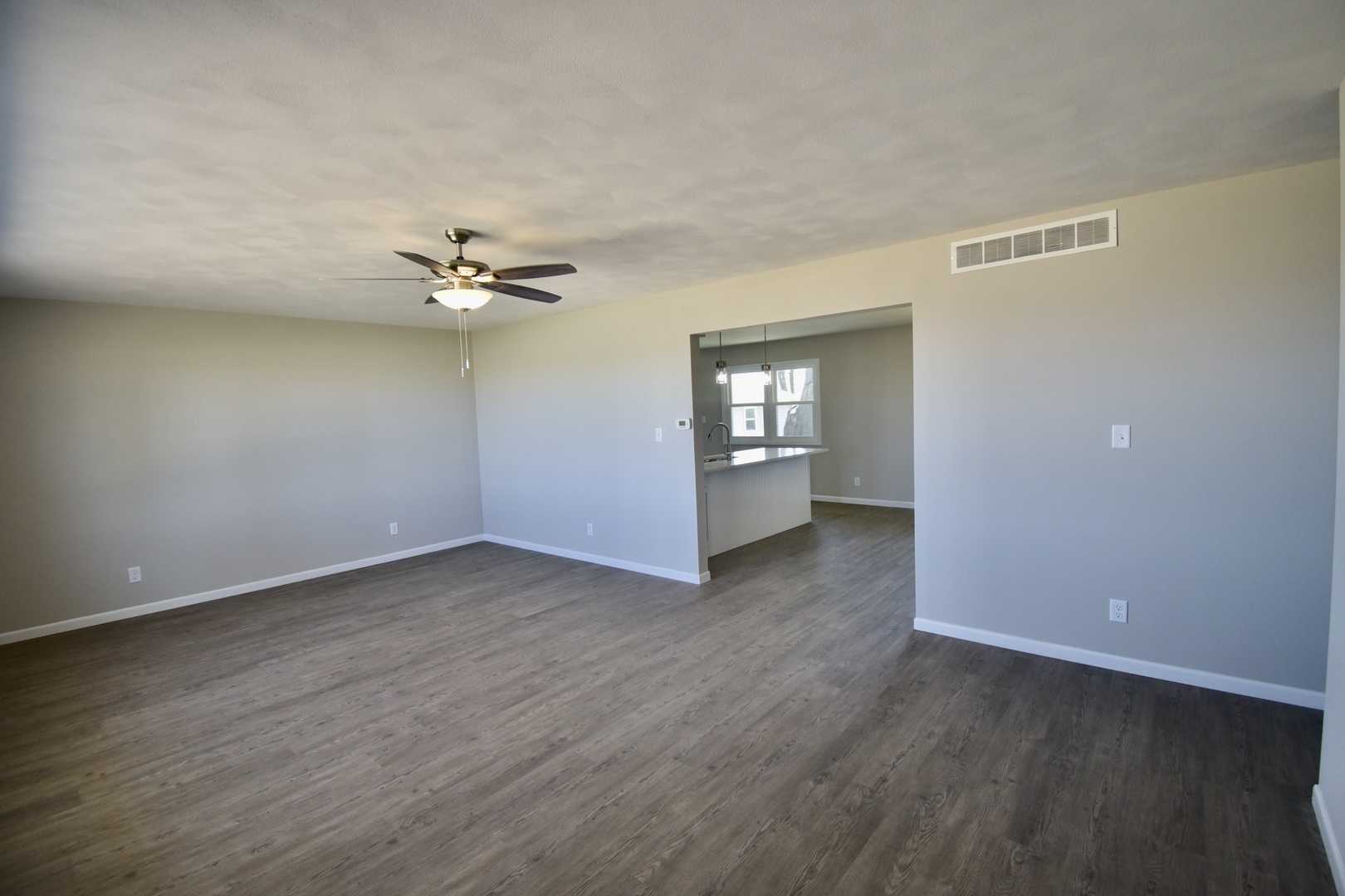 413 East Northtown Road North Normal, IL 61761 - Photo 7 of 20 wooden floor in an empty room with a window