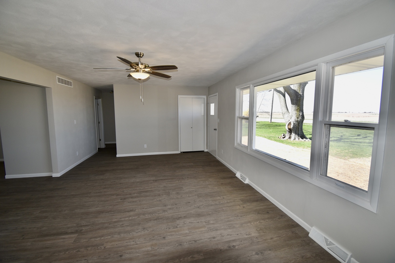 413 East Northtown Road North Normal, IL 61761 - Photo 8 of 20 wooden floor in an empty room with a window