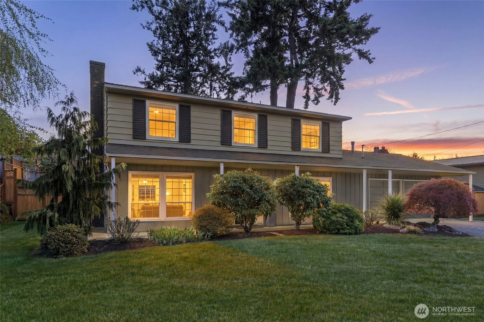 17154 Northeast 5th Street Bellevue, WA 98008 - Photo 2 of 40 a front view of a house with garden