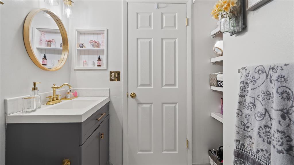 8203 Sun Spring Circle, Unit 12 Orlando, FL 32825 - Photo 20 of 38 a bathroom with a sink and a mirror