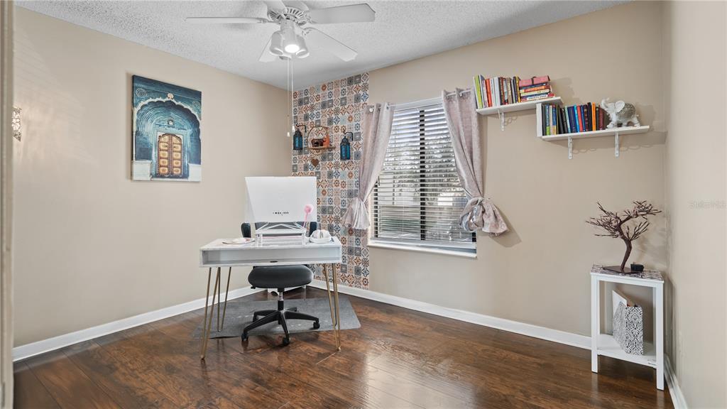 8203 Sun Spring Circle, Unit 12 Orlando, FL 32825 - Photo 21 of 38 a view of a workspace with furniture and a window