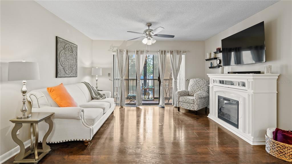 8203 Sun Spring Circle, Unit 12 Orlando, FL 32825 - Photo 22 of 38 a living room with furniture and a fireplace