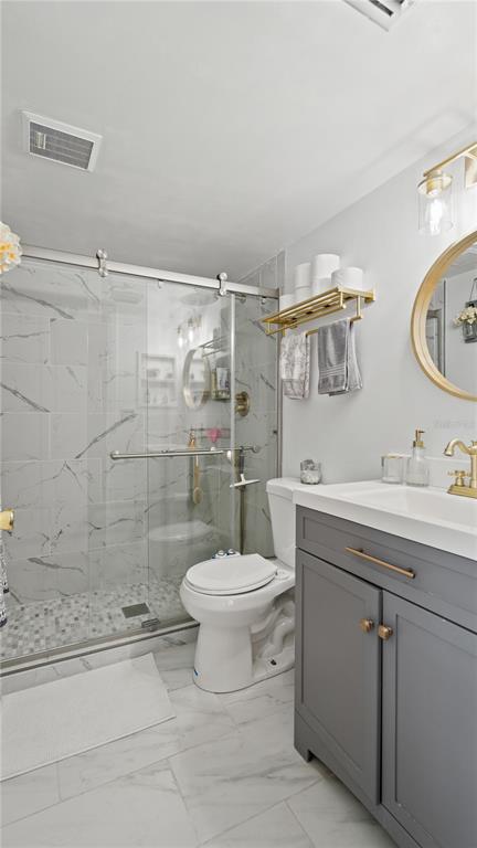 8203 Sun Spring Circle, Unit 12 Orlando, FL 32825 - Photo 29 of 38 a bathroom with a sink toilet and shower