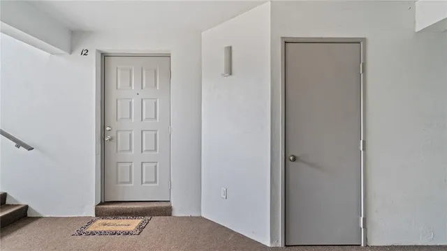 a view of an entryway with front door