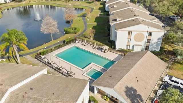 an aerial view of a house with a swimming pool