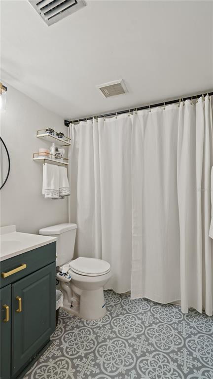 8203 Sun Spring Circle, Unit 12 Orlando, FL 32825 - Photo 9 of 38 a bathroom with a sink toilet and shower