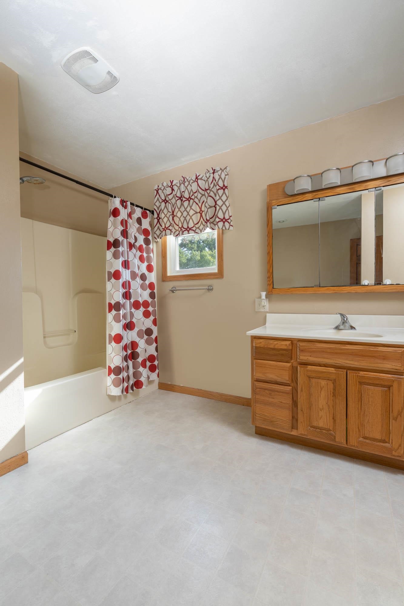 4868 Garden Prairie Road Belvidere, IL 61008 - Photo 14 of 36 a bathroom with a sink and a mirror