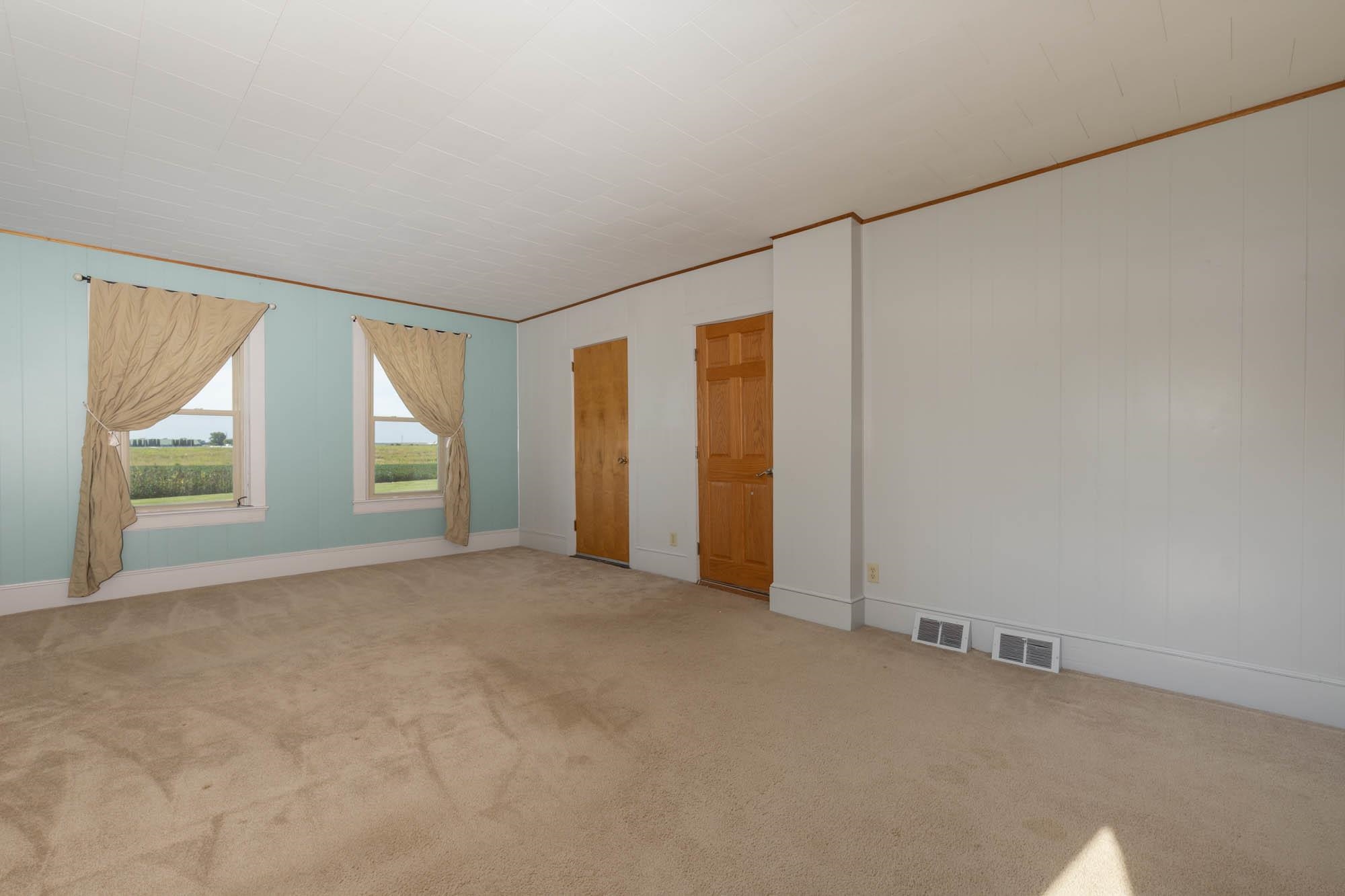 4868 Garden Prairie Road Belvidere, IL 61008 - Photo 16 of 36 an empty room with windows and closet