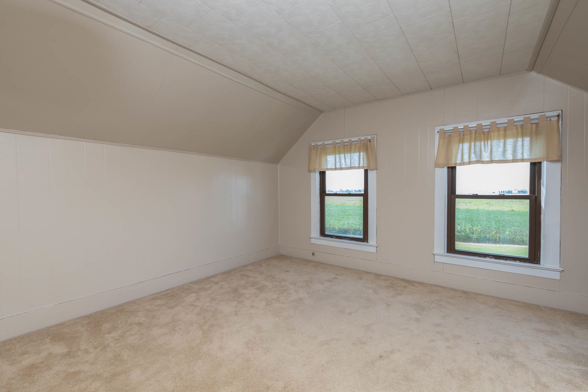 4868 Garden Prairie Road Belvidere, IL 61008 - Photo 20 of 36 an empty room with windows