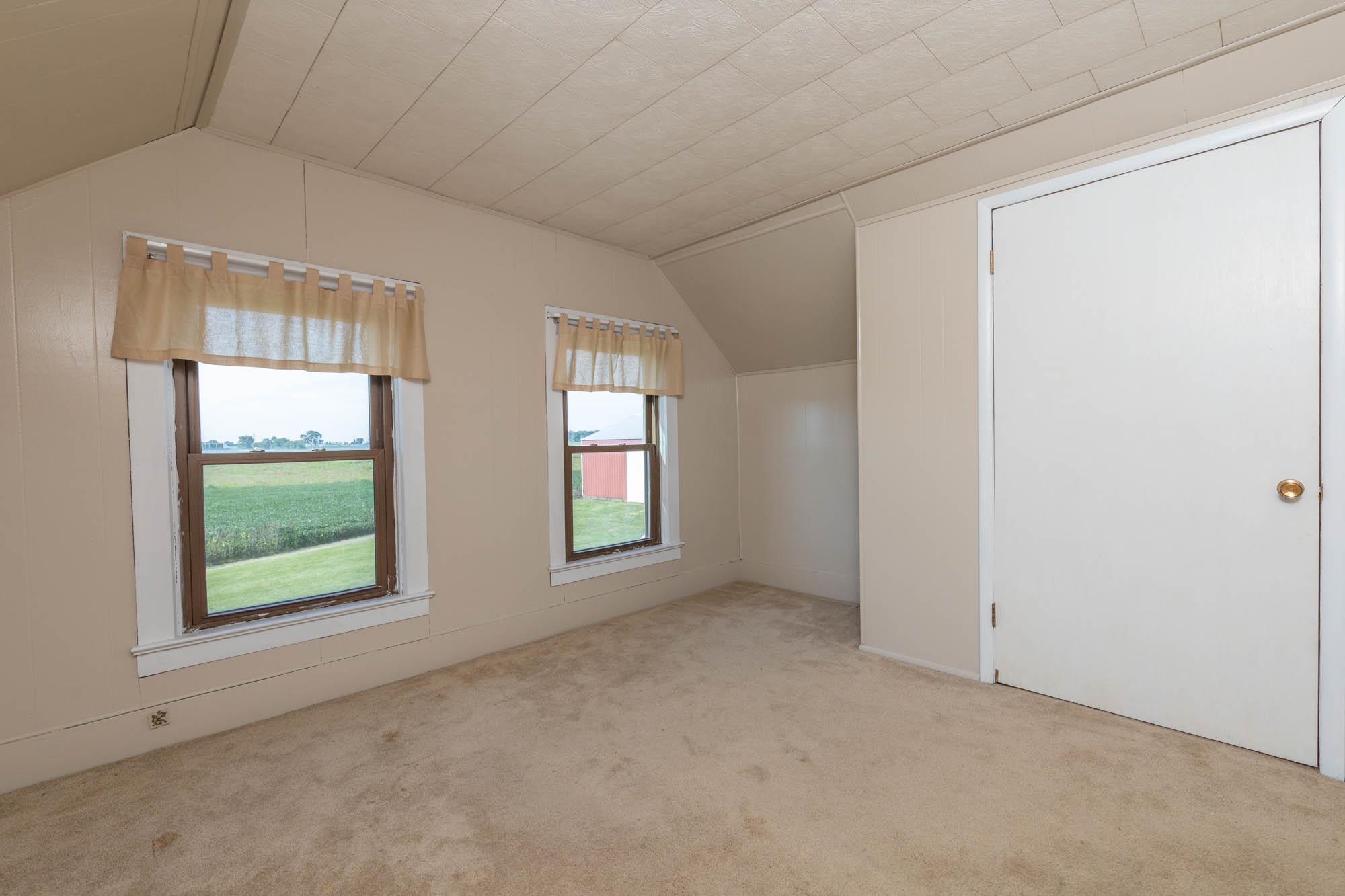 4868 Garden Prairie Road Belvidere, IL 61008 - Photo 21 of 36 an empty room with windows