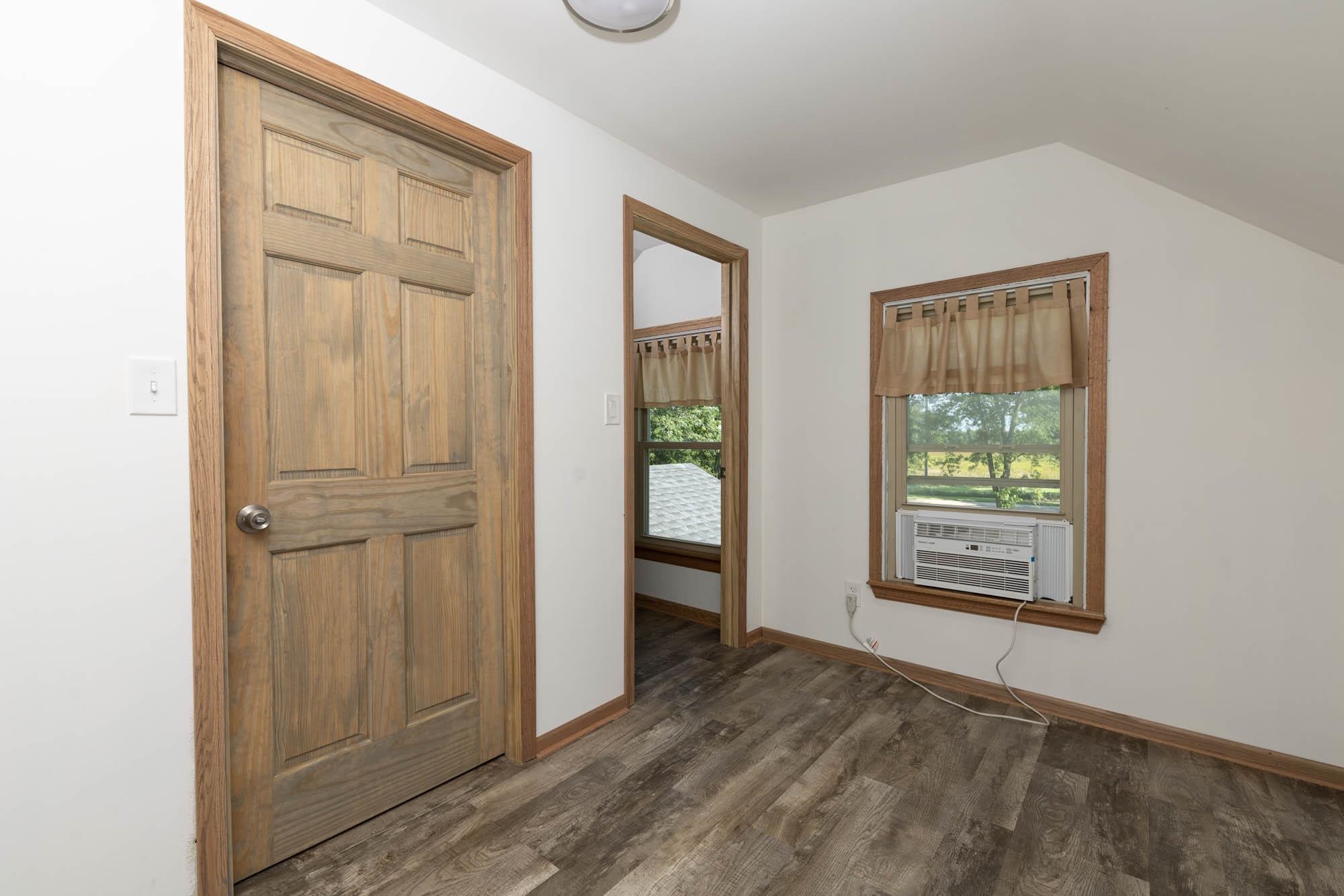 4868 Garden Prairie Road Belvidere, IL 61008 - Photo 23 of 36 a view of an empty room with a window