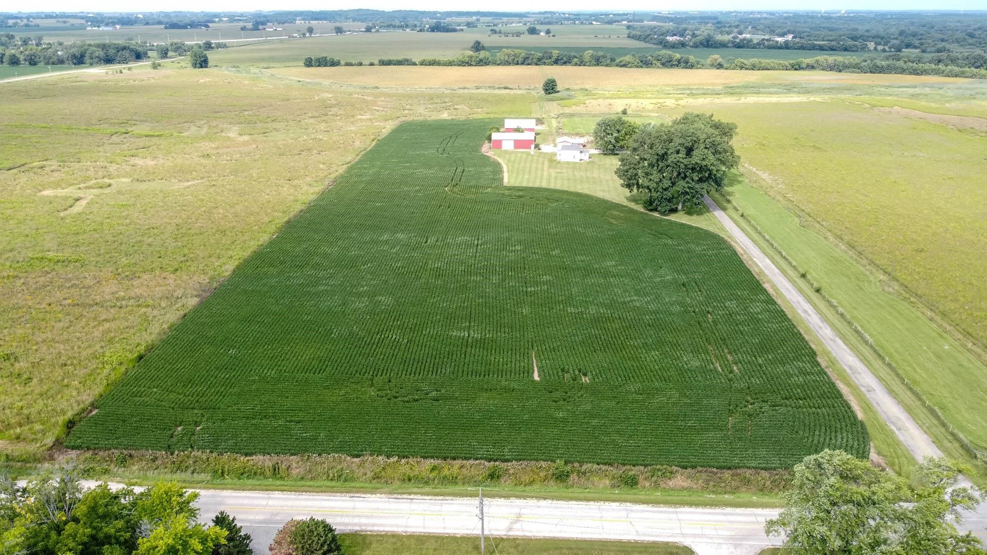 4868 Garden Prairie Road Belvidere, IL 61008 - Photo 35 of 36 a view of a lake with a big yard