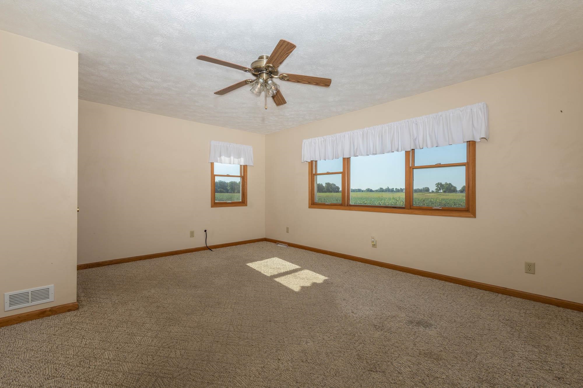 4868 Garden Prairie Road Belvidere, IL 61008 - Photo 6 of 36 a view of an empty room with a window