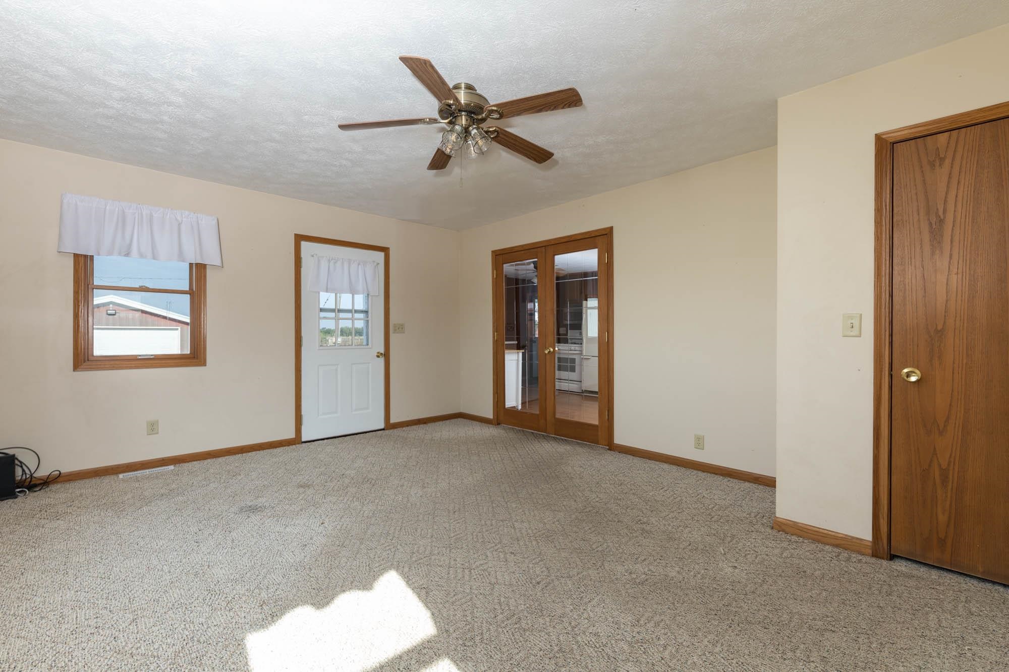4868 Garden Prairie Road Belvidere, IL 61008 - Photo 7 of 36 an empty room with closet and windows