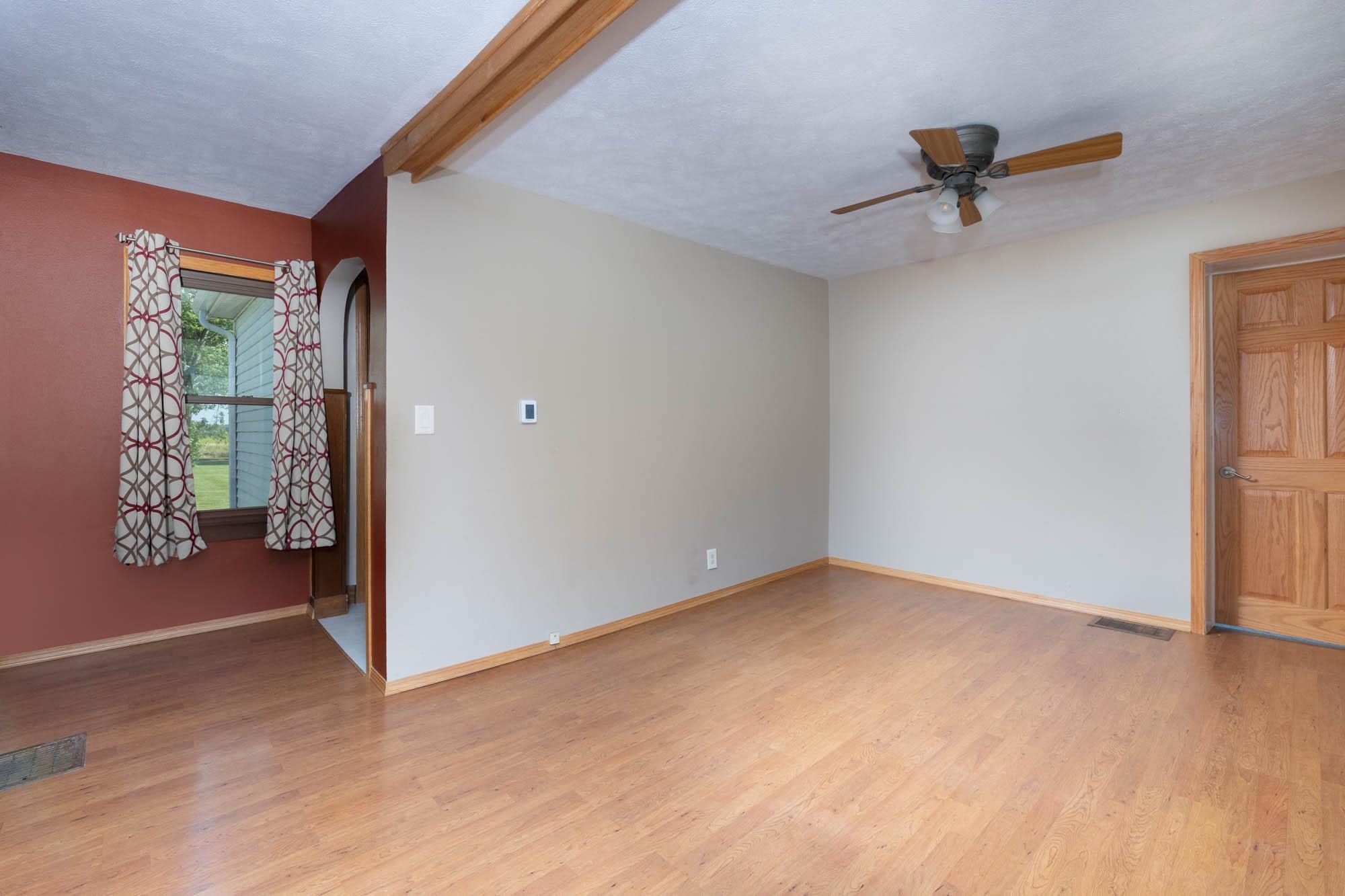 4868 Garden Prairie Road Belvidere, IL 61008 - Photo 10 of 36 a view of an empty room with a window
