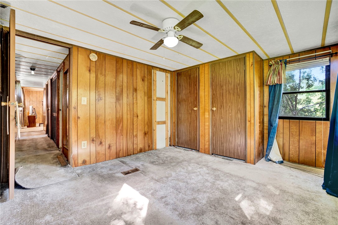 1504 Park Ridge Drive Seneca, SC 29672 - Photo 15 of 16 Rich wood paneling lines the walls of this classic bedroom, complete with dual closets.