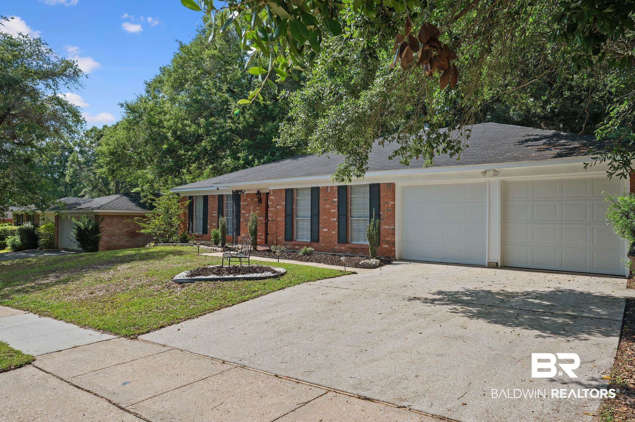 4724 Wicker Way Mobile, AL 36609 - Photo 30 of 36 Brick exterior with a prominent two-car garage