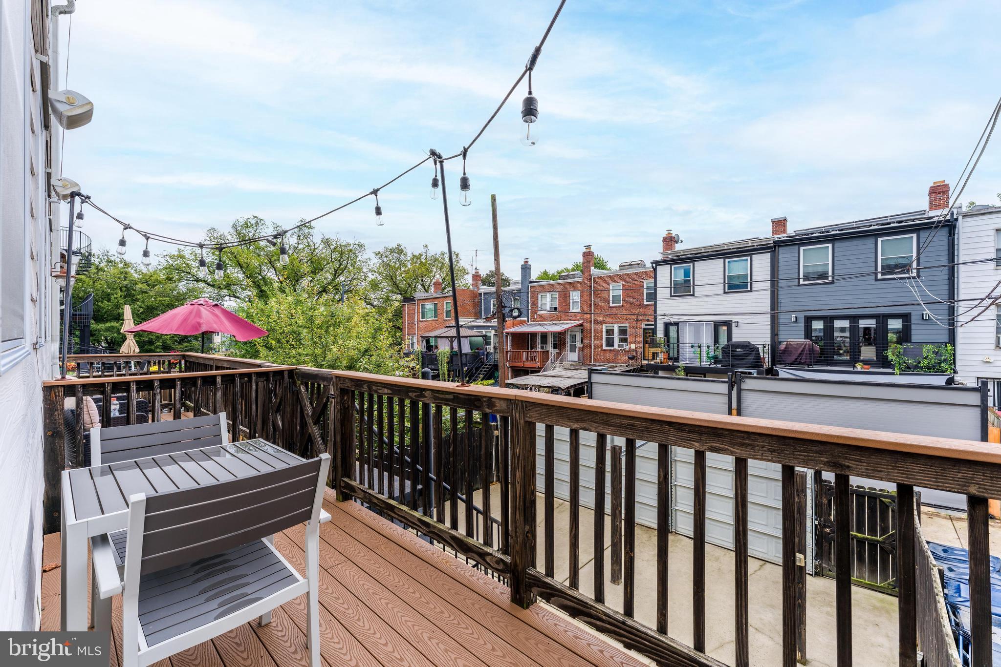 1613 Isherwood Street Northeast, Unit 3 Washington, DC 20002 - Photo 18 of 23 a view of a balcony with two chairs and a table