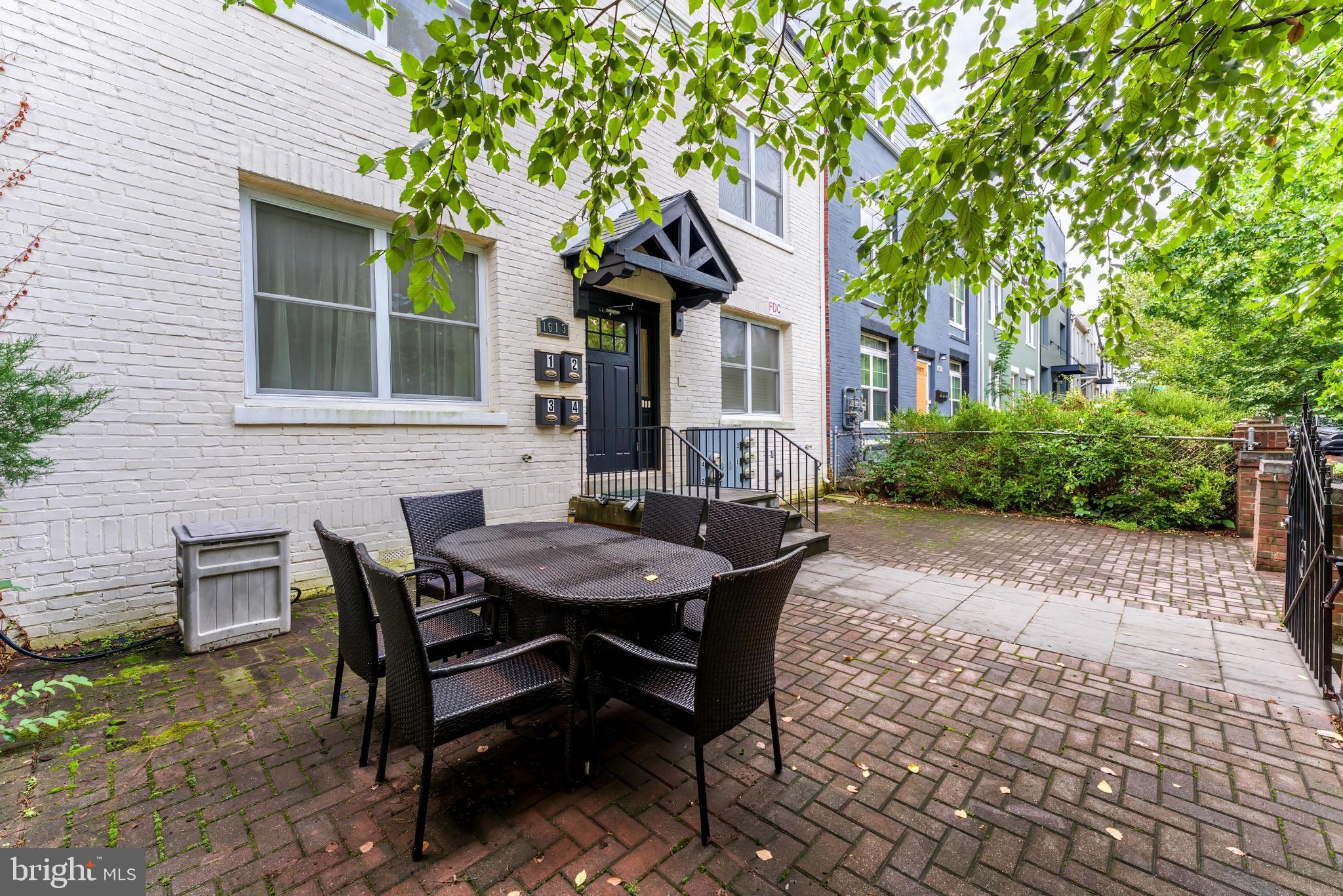 1613 Isherwood Street Northeast, Unit 3 Washington, DC 20002 - Photo 23 of 23 a view of a house with backyard and sitting area