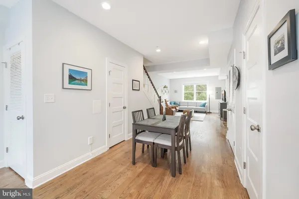 a workspace with wooden floor and furniture