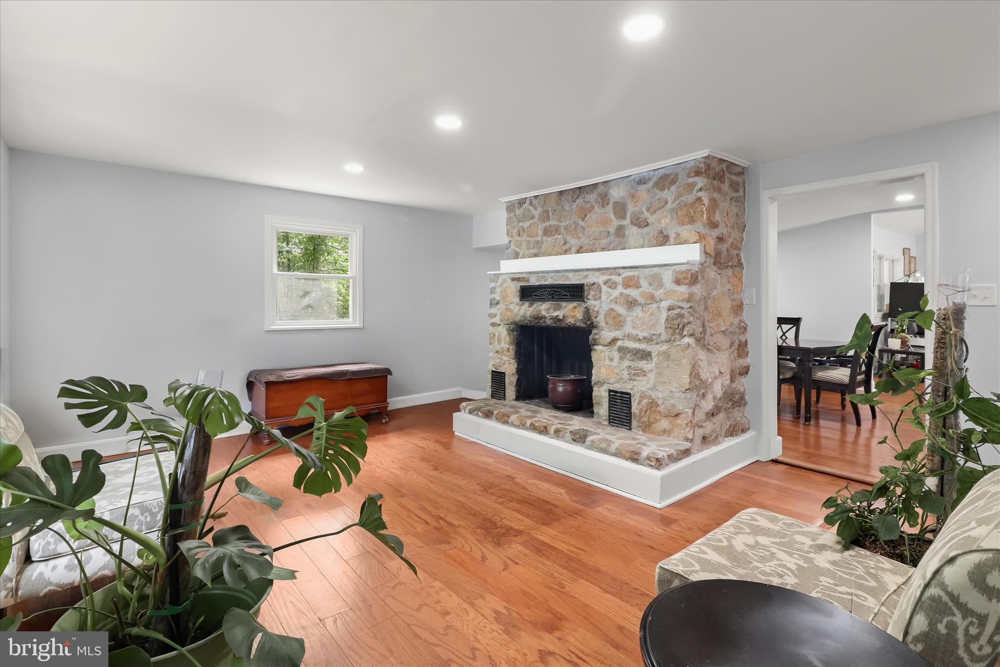 14213 Longnecker Road Reisterstown, MD 21136 - Photo 12 of 44 a living room with furniture large mirror and fireplace