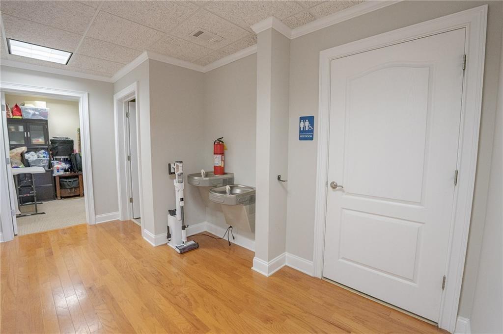 530 Highland Station Drive, Unit 2003 Suwanee, GA 30024 - Photo 5 of 6 a room that has a bed and a view of kitchen