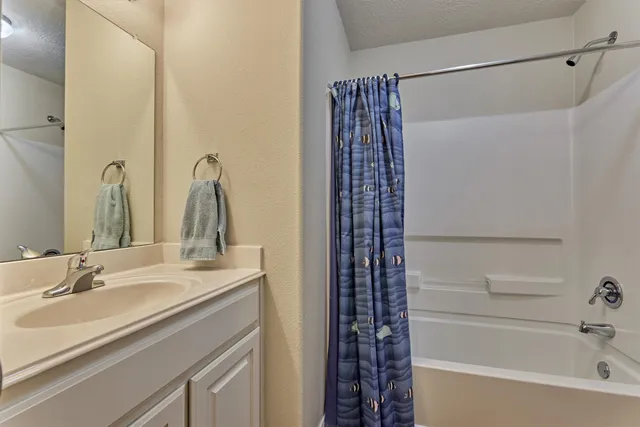 a bathroom with a sink and a bathtub