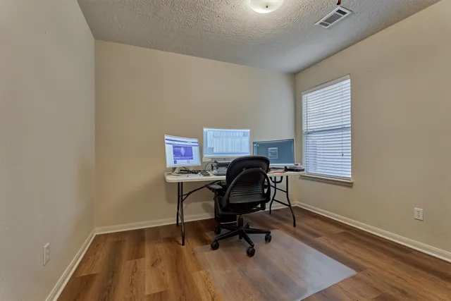 a workspace with furniture and a window