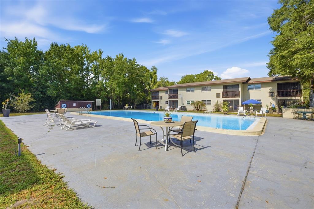 141 Fernery Road, Unit A3 Lakeland, FL 33809 - Photo 28 of 40 a view of a house with sitting area and swimming pool